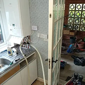A kitchen with a sink and a window.