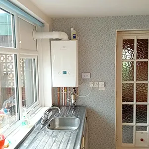 A kitchen with a sink and a window.
