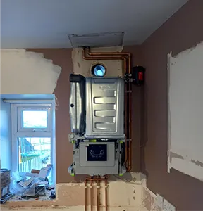 a room that is being remodeled with a water heater